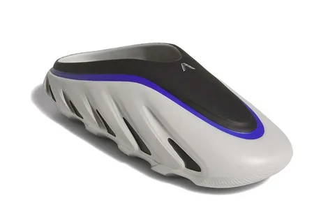 Sabot futuriste gris avec détails noirs et violets, semelle texturée.