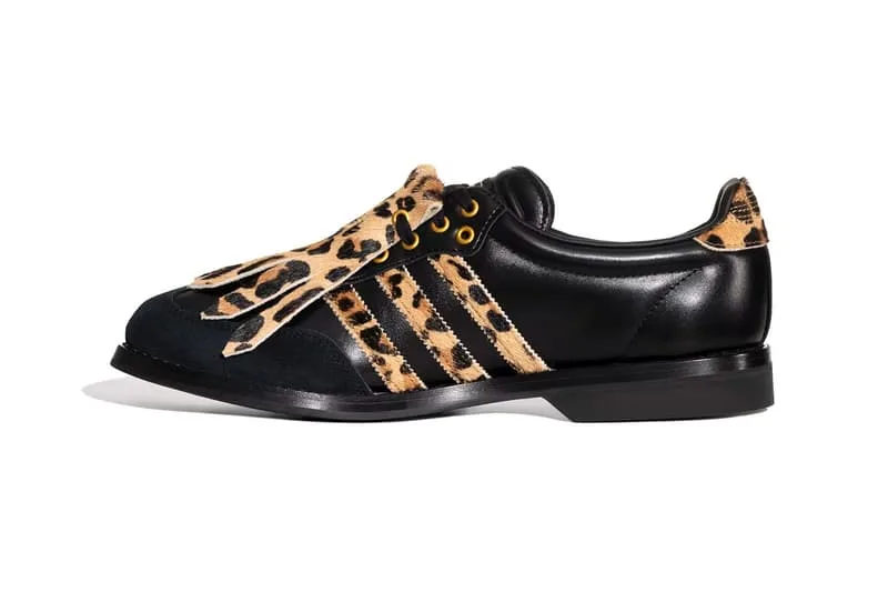 Chaussure noire avec motif léopard et lacets ornés