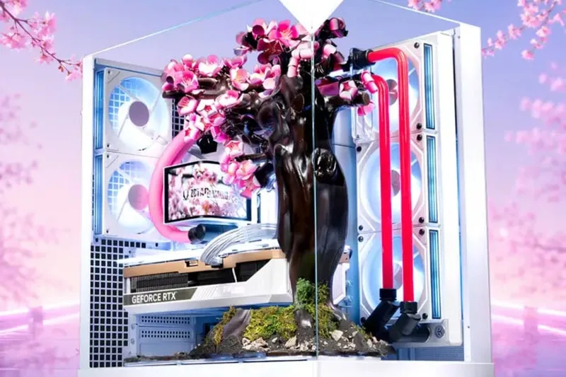 PC mod avec arbre et fleurs roses, tubes LED et carte GeForce RTX.