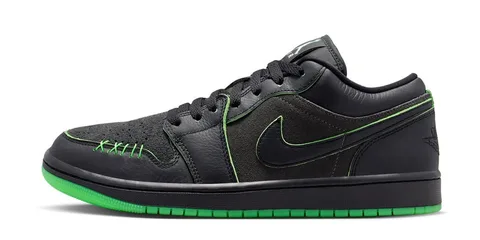 Chaussure noire avec détails verts et logo Nike en vert