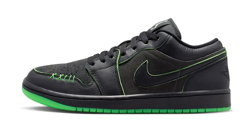 Chaussure noire avec détails verts et logo Nike en vert