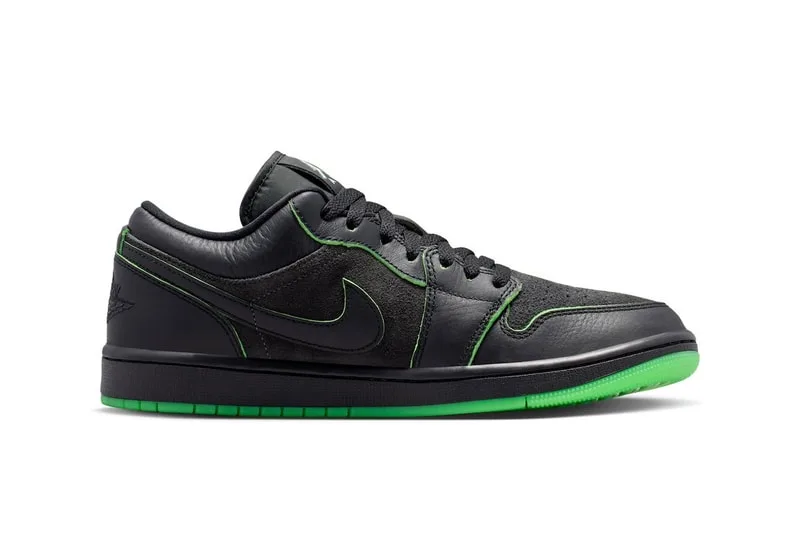 Chaussure noire avec détails verts et logo Nike visible.