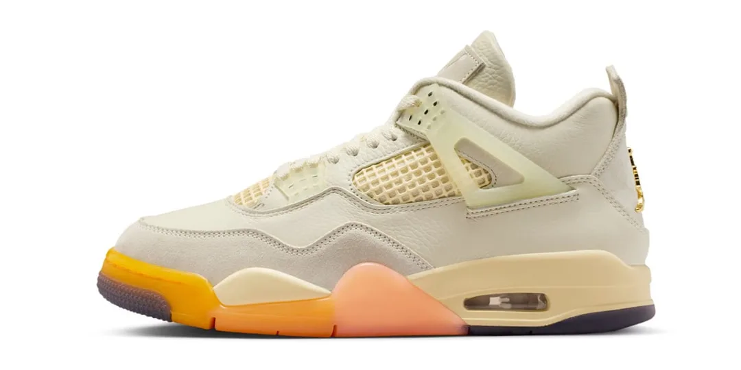 Chaussure beige et orange avec détails ajourés et semelle coussinée.