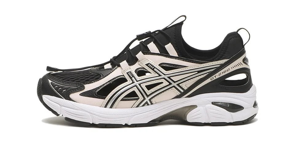 Basket de sport noire et blanche avec détails en mesh.