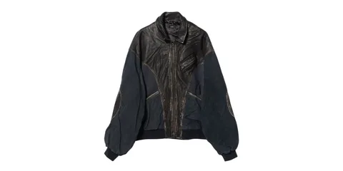 Veste en cuir noir avec fermetures éclair apparentes.
