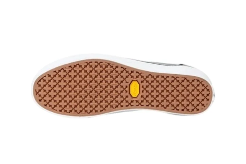 Semelle de chaussure, motif géométrique et pastille jaune au centre