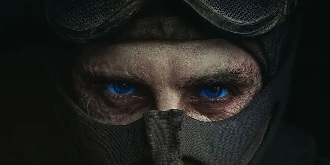 Gros plan sur les yeux d’un homme portant un masque et des lunettes de protection.