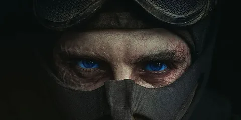 Gros plan sur les yeux d’un homme portant un masque et des lunettes de protection.
