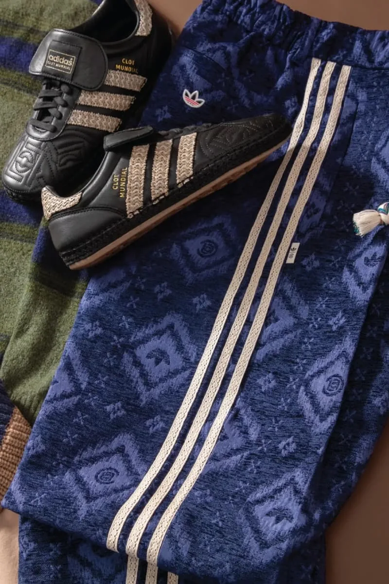 Vêtements Adidas avec chaussures noires et détails dorés.