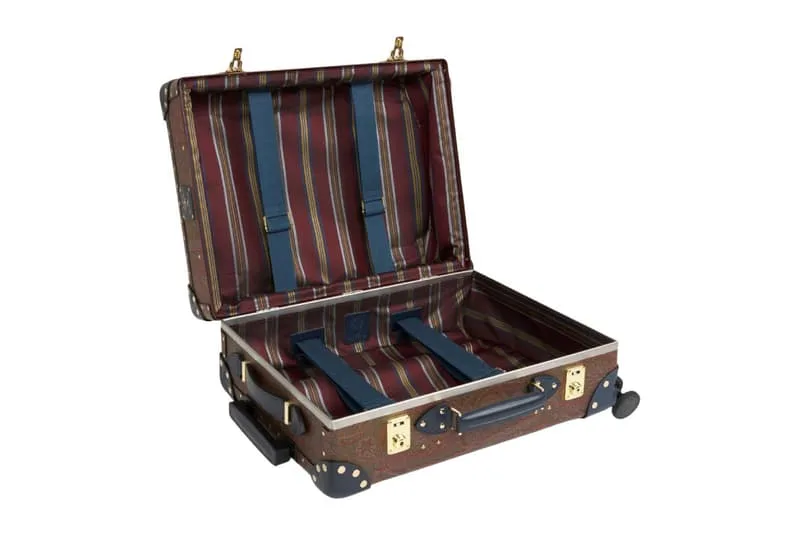 Valise ouverte avec doublure rayée et sangles bleues.