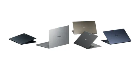 Cinq ordinateurs portables de différentes marques alignés.