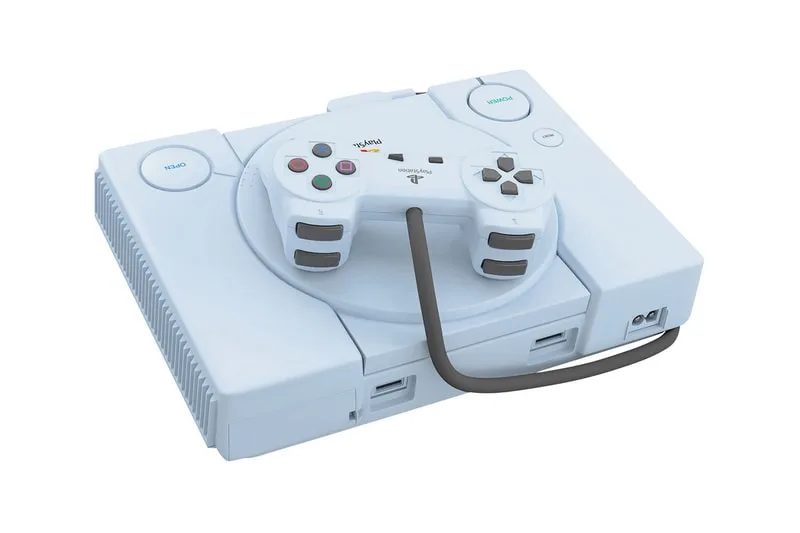 Console de jeu vidéo rétro blanche avec manette sur le dessus.