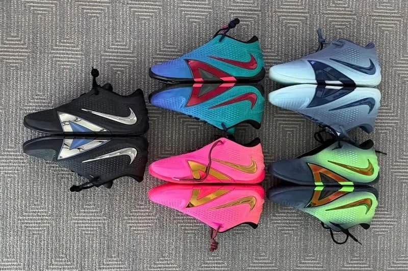 Collection de chaussures colorées sur un tapis gris.