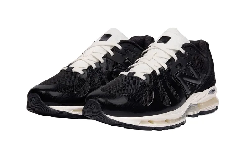 Chaussures de sport noires et blanches New Balance vues de face