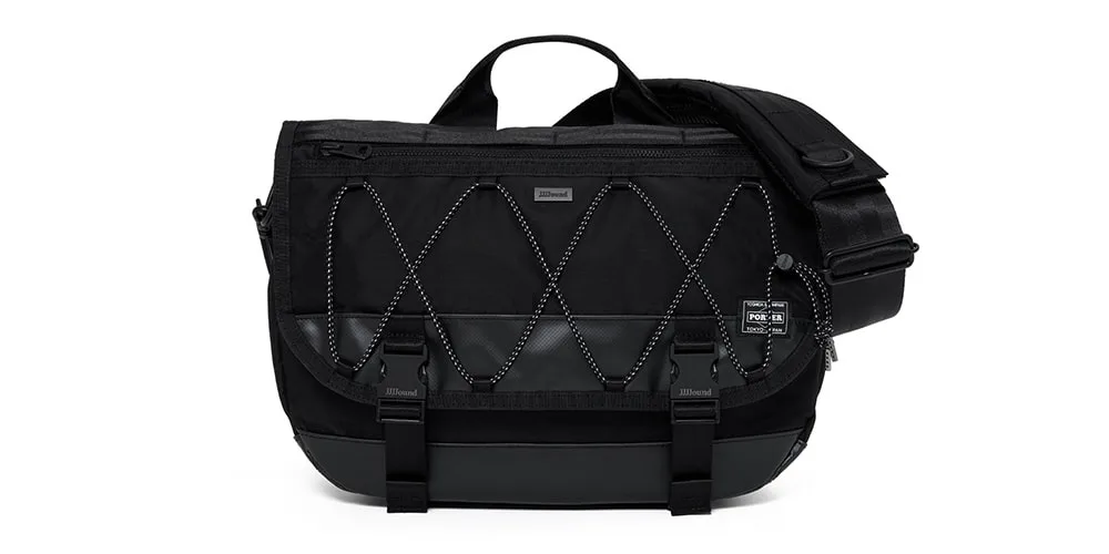 Sac messenger noir avec sangle et détails entrelacés.