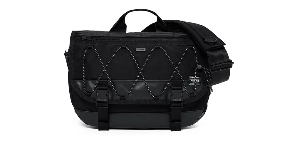 Sac messenger noir avec sangle et détails entrelacés.