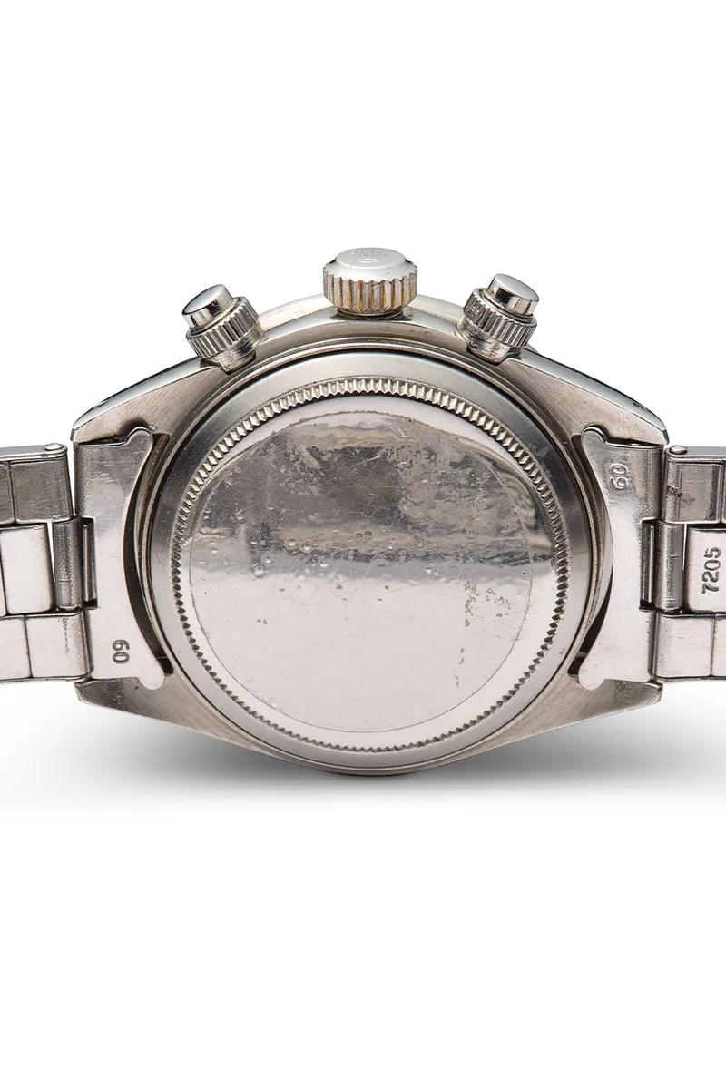 Vue arrière d'une montre métallique avec bracelet métal.