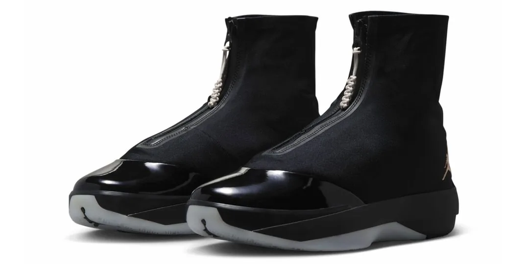 Chaussures noires élégantes avec zip central et bout verni.