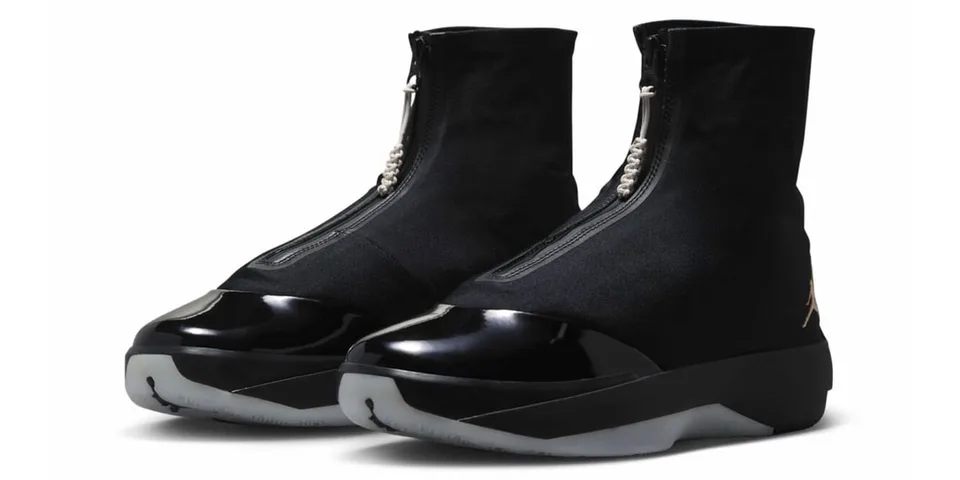 Chaussures noires élégantes avec zip central et bout verni.