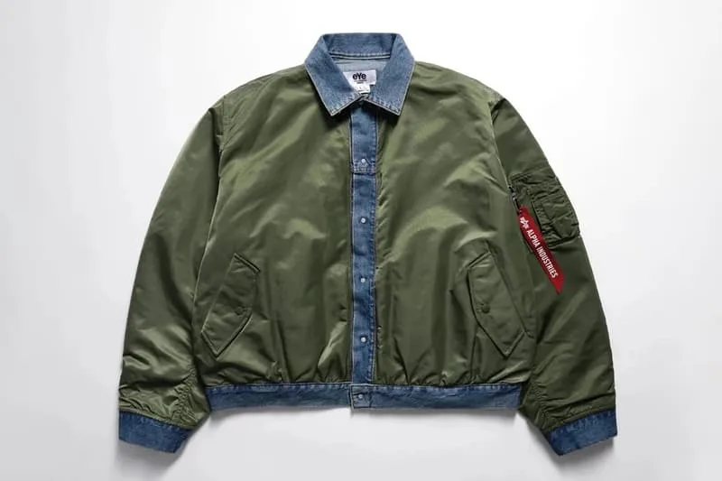Veste verte avec col en jean et poche rouge sur la manche