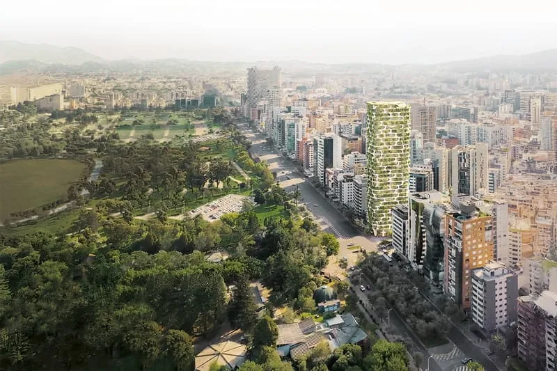 Vue aérienne d'une ville avec un immeuble végétalisé.
