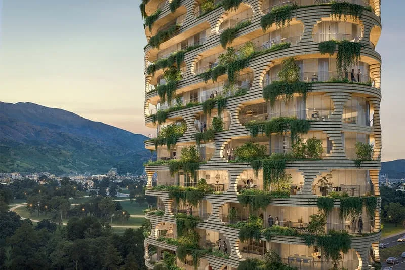 Immeuble moderne avec balcons verts et vue sur la ville et montagnes