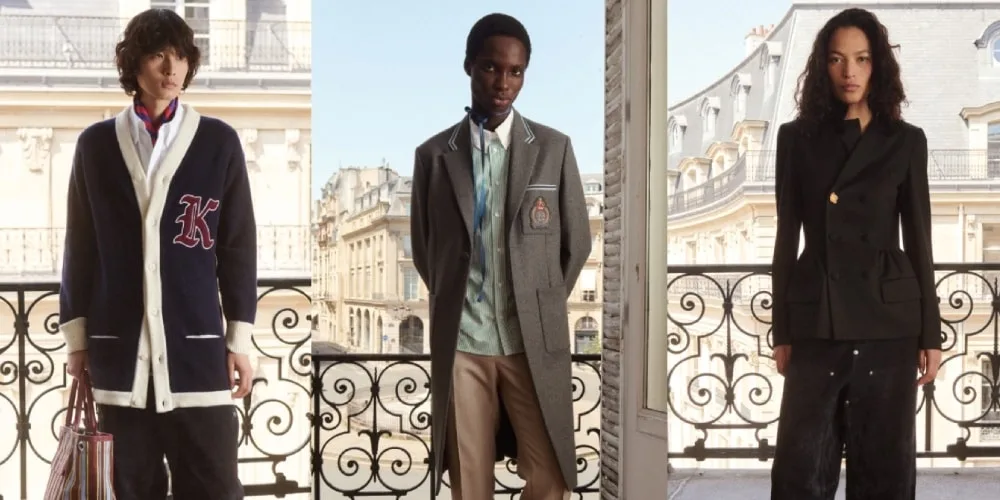 Trois modèles sur un balcon parisien, vêtus en tenue chic et moderne.