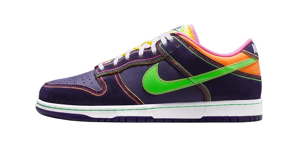 Chaussure colorée avec détails verts et orange sur fond blanc, style moderne.