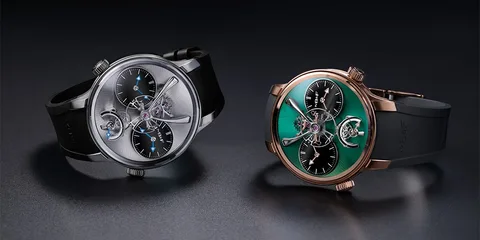 Deux montres modernes sur fond sombre.