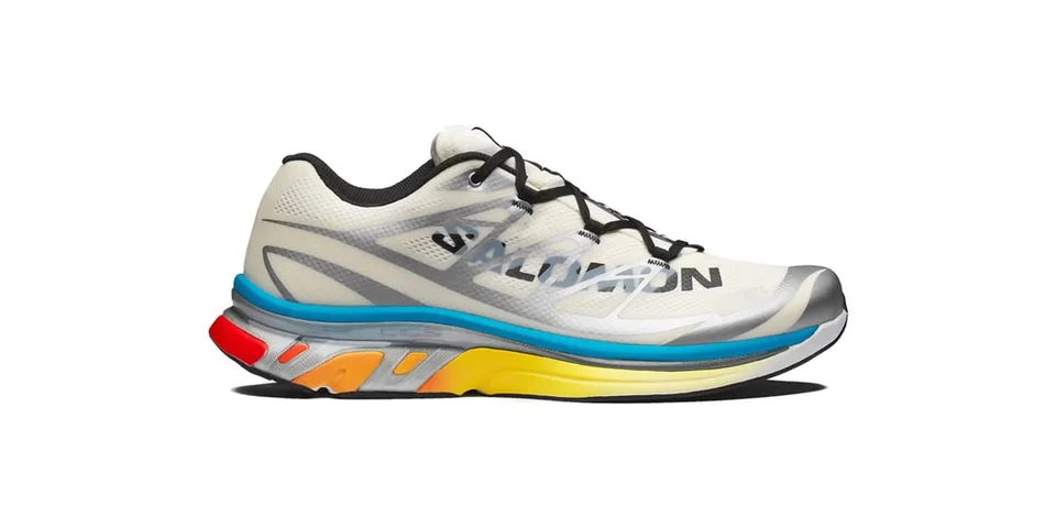 Chaussure de trail blanche et grise avec semelle colorée et logo Salomon