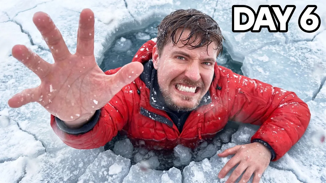 Homme dans la glace, main tendue, portant un manteau rouge, texte 'DAY 6'.