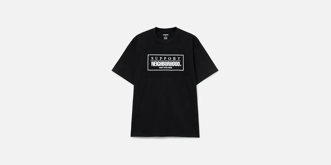 T-shirt noir avec texte blanc 'Support Neighborhood'.