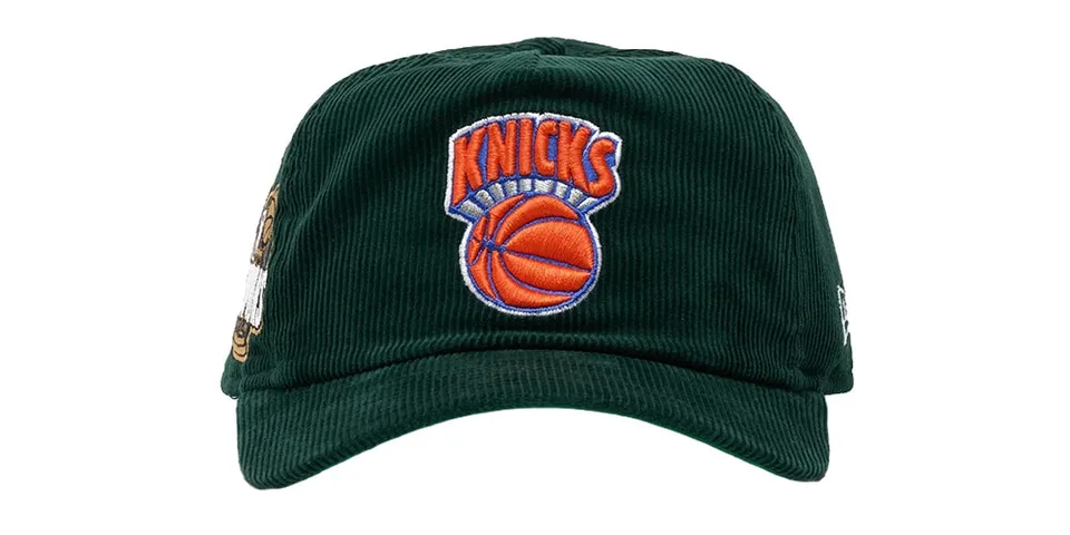 Casquette vert foncé des Knicks de New York avec logo brodé orange et bleu.
