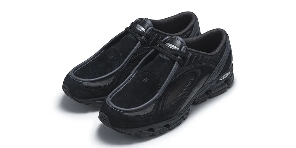 Paire de baskets noires en cuir et mesh sur fond blanc