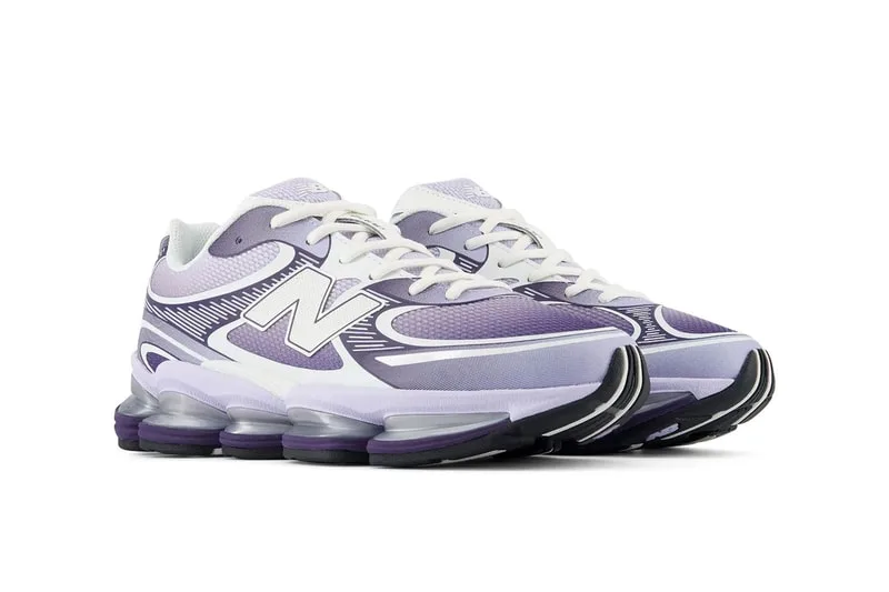 Chaussures de sport New Balance violettes et blanches avec semelle épaisse.