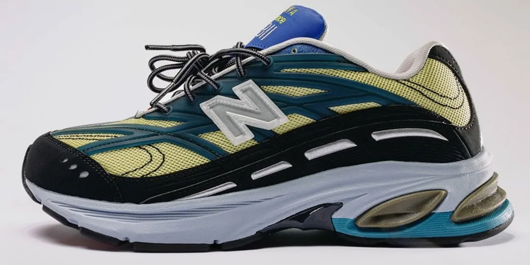 Chaussure de sport multicolore avec logo N sur le côté.