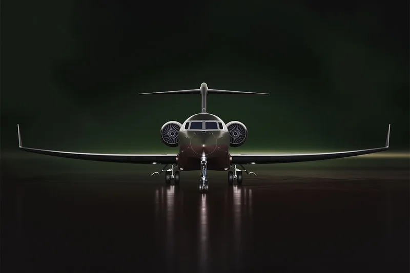 Avion privé luxe vu de face, sur fond sombre.