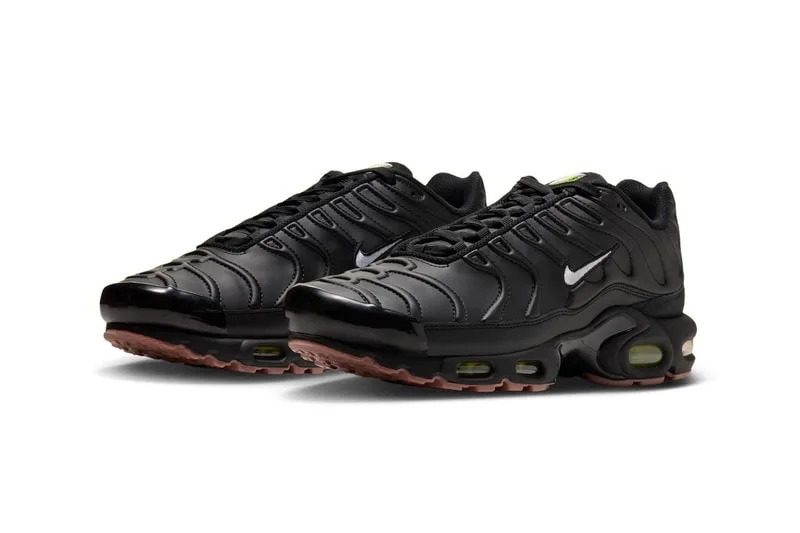 Chaussures noires avec semelles à coussin d'air et détails verts