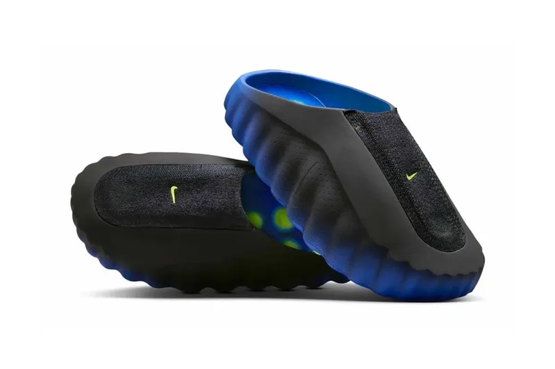 Chaussures noires et bleues avec semelles ondulées, logo vert visible.