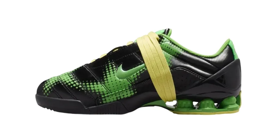 Chaussure de sport noire et verte avec semelle à coussin d'air