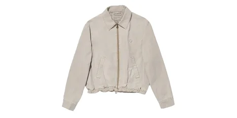 Blouson beige à fermeture éclair central et poches.