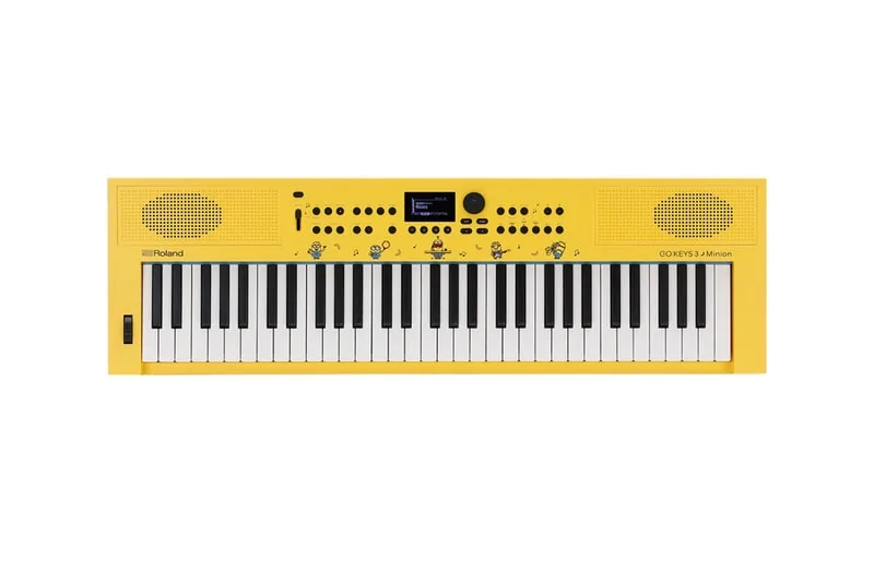 Clavier jaune avec motifs et haut-parleurs intégrés.