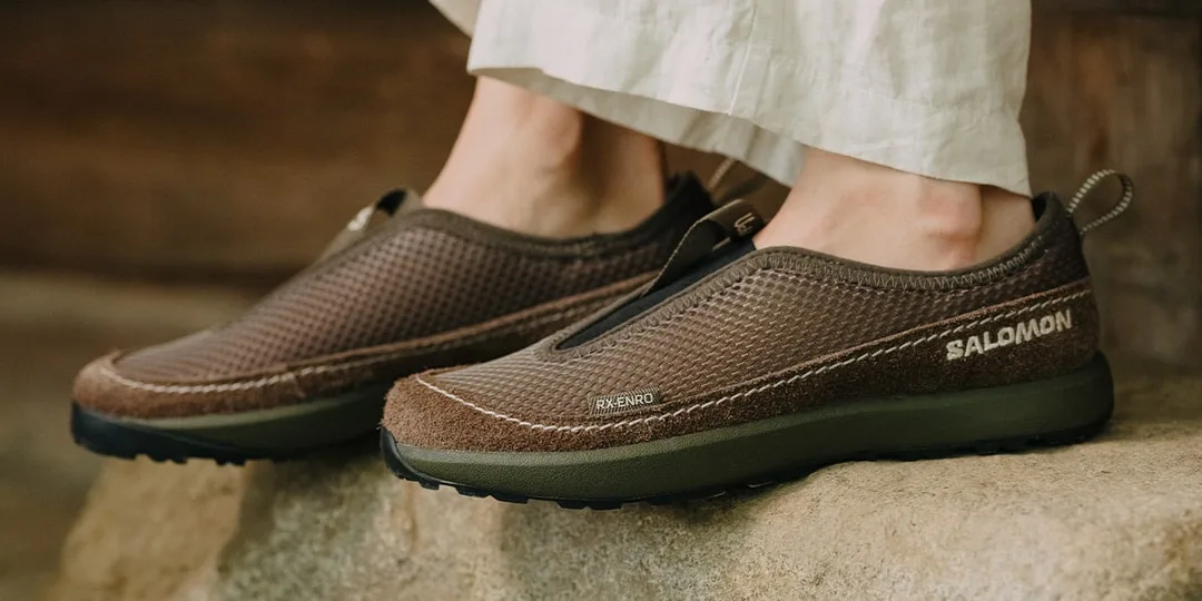 Chaussures marron Salomon portées par une personne debout