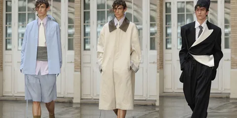 Défilé de mode avec vêtements élégants pour hommes.