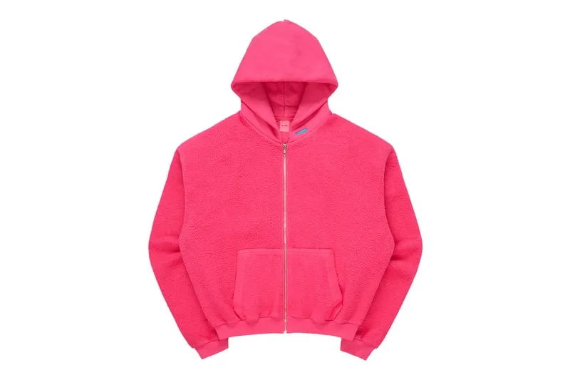 Sweat à capuche rose vif avec fermeture éclair.