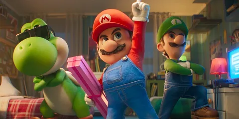 Mario, Luigi et Yoshi avec un cadeau dans une pièce colorée.