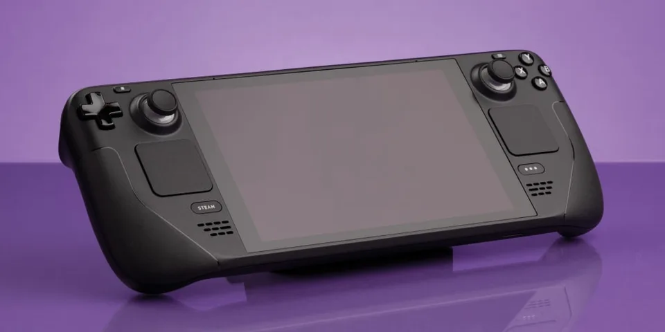 Console de jeu portable noire sur fond violet clair