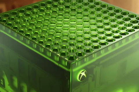 Gros plan d'une console Xbox verte avec motif en nid d'abeille.